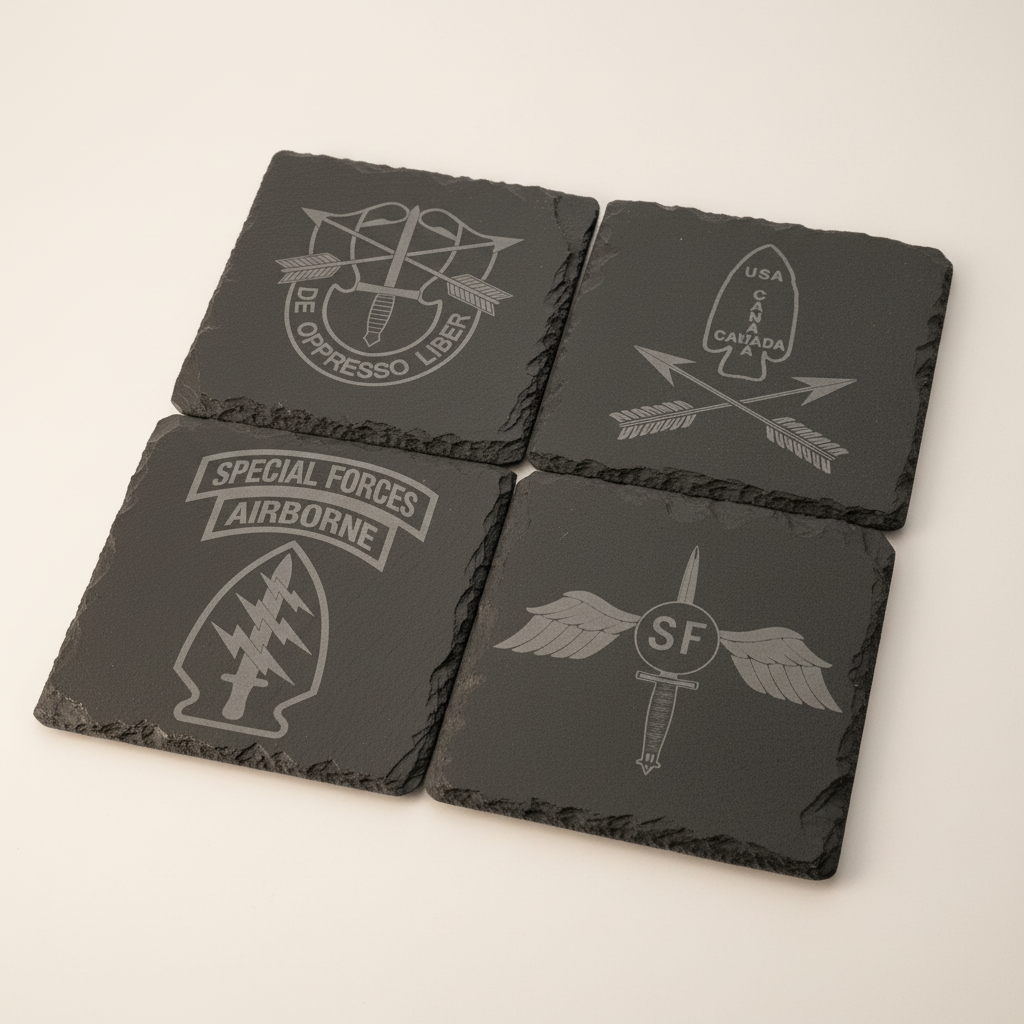 SF Slate Coaster Set arranged as four dark slate coasters with engraved Special Forces designs on a warm-white studio background